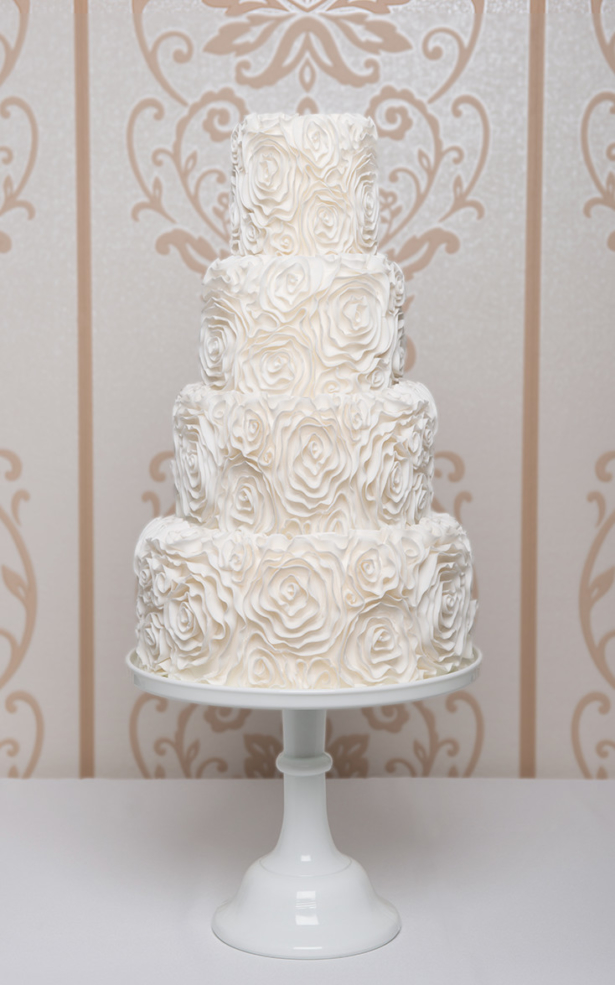 ruffled white wedding cake