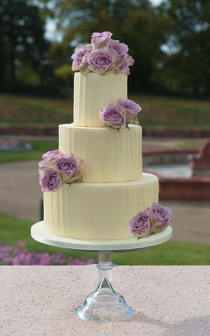 Rustic Wedding Cake - custom designed 3 tier textured ganache with roses